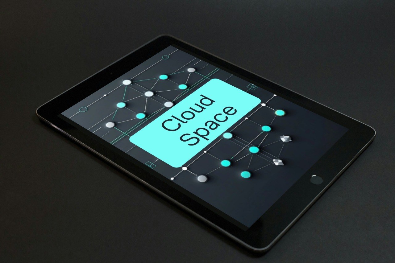 A black tablet device shown at an angle on a dark surface, with the screen displaying a software interface labeled 'Prime Layout'.