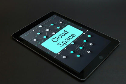 A black tablet device shown at an angle on a dark surface, with the screen displaying a software interface labeled 'Prime Layout'.