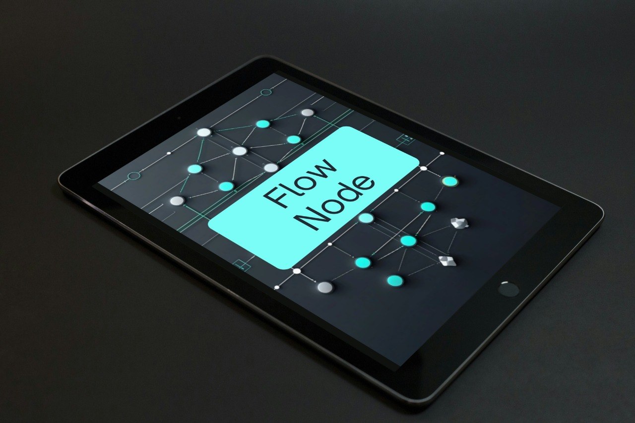 A black tablet device shown at an angle on a dark surface, with the screen displaying a software interface labeled 'Prime Layout'.